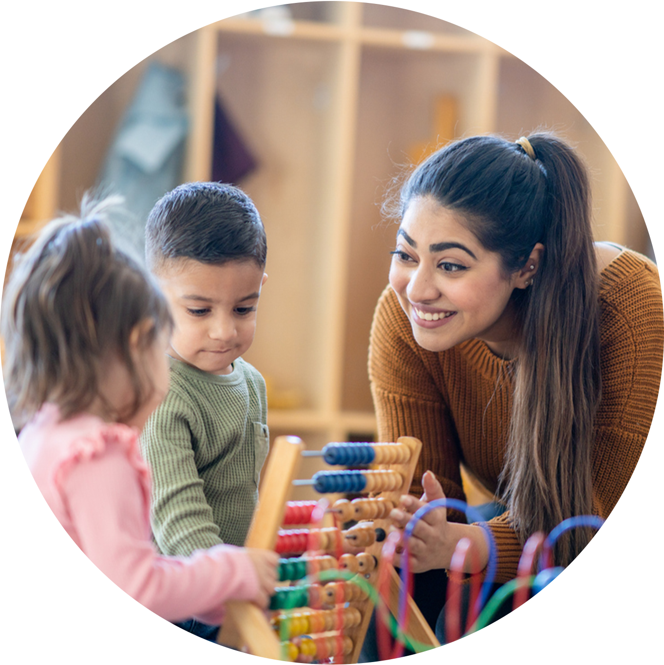 Photo of teacher playing with kids